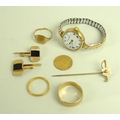 A group of gold jewellery, comprising an Edward VII half sovereign, 1907, two 9ct gold rings, a 9ct ... 