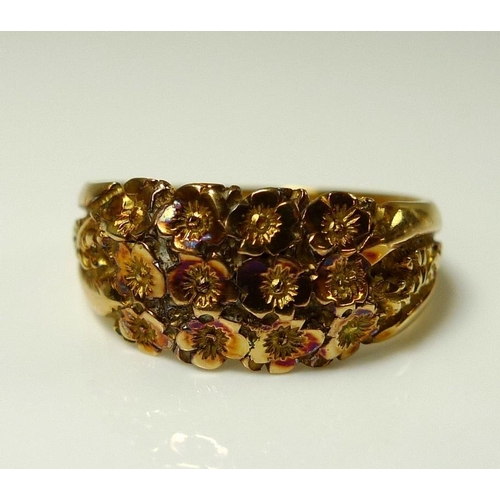 861 - An 18ct gold ring decorated with a garland of flowers, size M, 4.5g, and a 14ct gold ring, the swirl... 