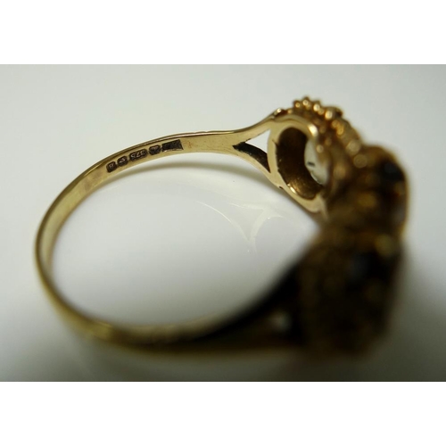 865 - A 9ct gold and yellow topaz ring, the three oval stones each 7.7 by 5.2 by 3.3mm and mounted in a ro... 