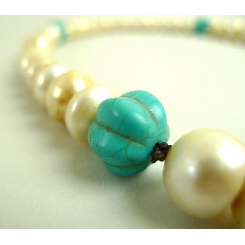 873 - A Chinese pearl and turquoise necklace, the fifty four large ringed pearls each approximately 11.2 t... 