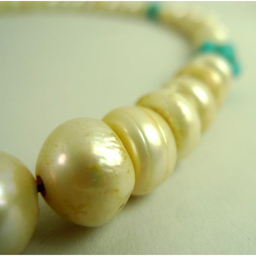 873 - A Chinese pearl and turquoise necklace, the fifty four large ringed pearls each approximately 11.2 t... 