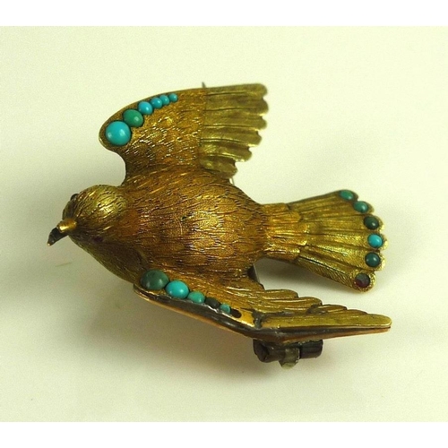 882 - A vintage yellow metal brooch designed as a dove with wings outstretched, the finely textured body w... 