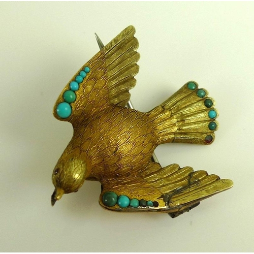 882 - A vintage yellow metal brooch designed as a dove with wings outstretched, the finely textured body w... 