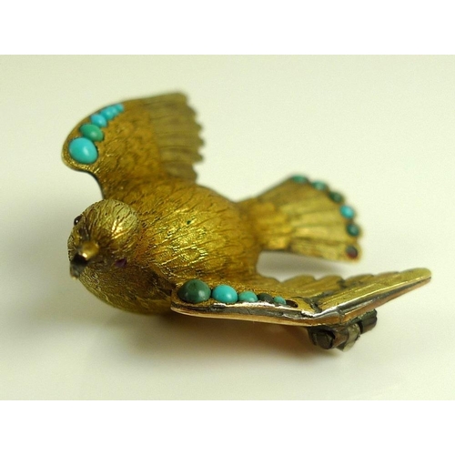 882 - A vintage yellow metal brooch designed as a dove with wings outstretched, the finely textured body w... 