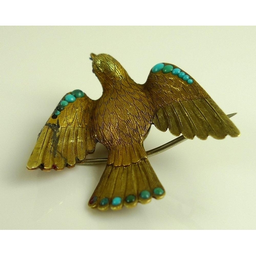 882 - A vintage yellow metal brooch designed as a dove with wings outstretched, the finely textured body w... 