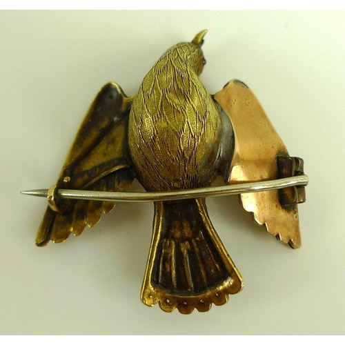 882 - A vintage yellow metal brooch designed as a dove with wings outstretched, the finely textured body w... 