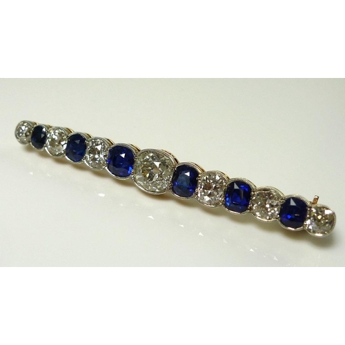 894 - A diamond, sapphire and 9ct gold bar brooch, early 20th century, with central 1.6ct round brilliant ... 