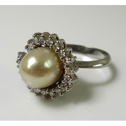 898 - An 18ct white gold, diamond and oval pearl dress ring, total diamond weight approximately 1ct, pearl... 