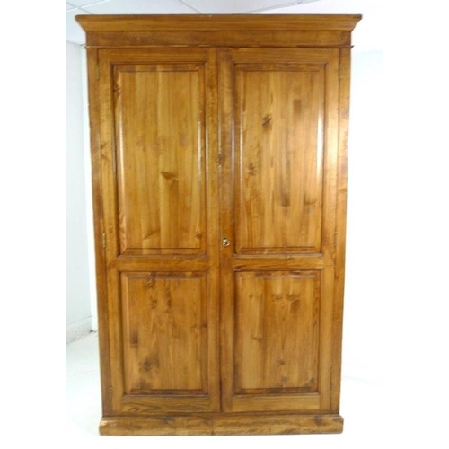 908A - A mid 20th century pitch pine cupboard, two full length doors enclosing four shelves, 127 by 48.5 by... 