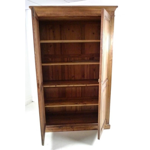 908A - A mid 20th century pitch pine cupboard, two full length doors enclosing four shelves, 127 by 48.5 by... 