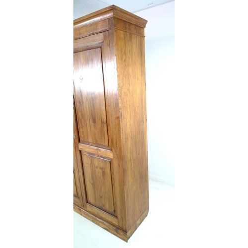 908A - A mid 20th century pitch pine cupboard, two full length doors enclosing four shelves, 127 by 48.5 by... 