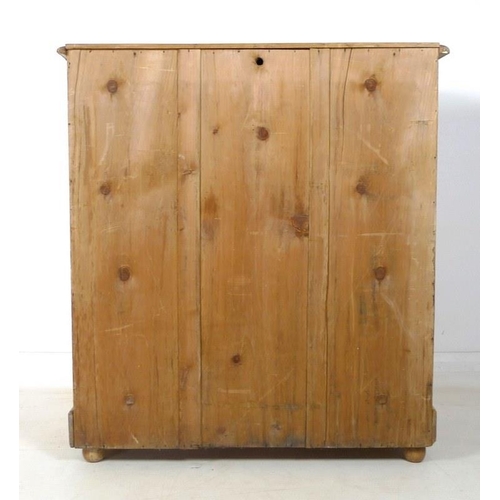 910A - A Victorian pine chest of two short over three long graduating drawers with turned handles, brass es... 