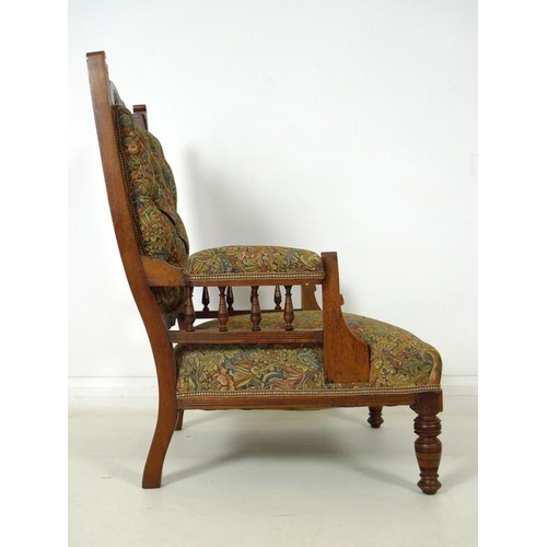 916 - A late Victorian mahogany armchair, with carved decoration, open baluster form arms, recently re-uph... 