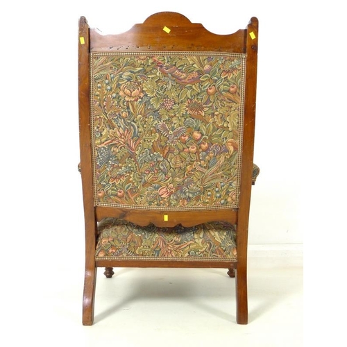 916 - A late Victorian mahogany armchair, with carved decoration, open baluster form arms, recently re-uph... 