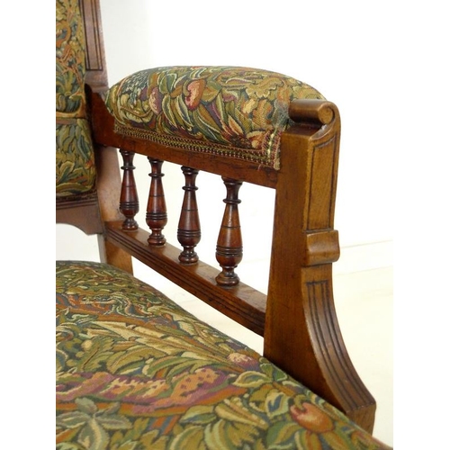 916 - A late Victorian mahogany armchair, with carved decoration, open baluster form arms, recently re-uph... 