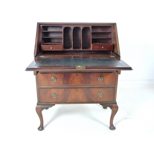 927 - An early 20th century writing desk bureau with leather inlay and cabriole legs, 77 by 44 by 105cm hi... 