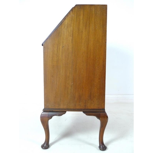 927 - An early 20th century writing desk bureau with leather inlay and cabriole legs, 77 by 44 by 105cm hi... 