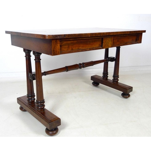 931A - An early Victorian mahogany desk, two frieze drawers, turned column supports and stretcher, glass pr... 