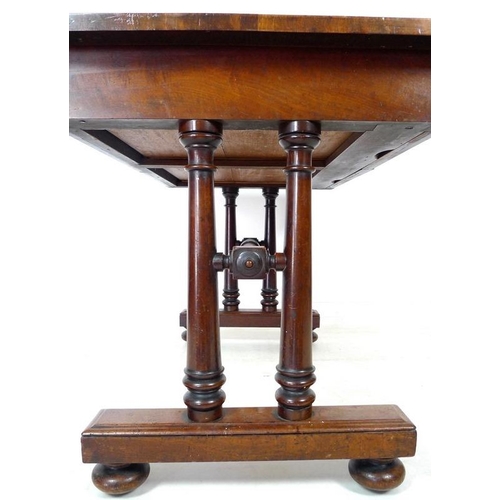 931A - An early Victorian mahogany desk, two frieze drawers, turned column supports and stretcher, glass pr... 