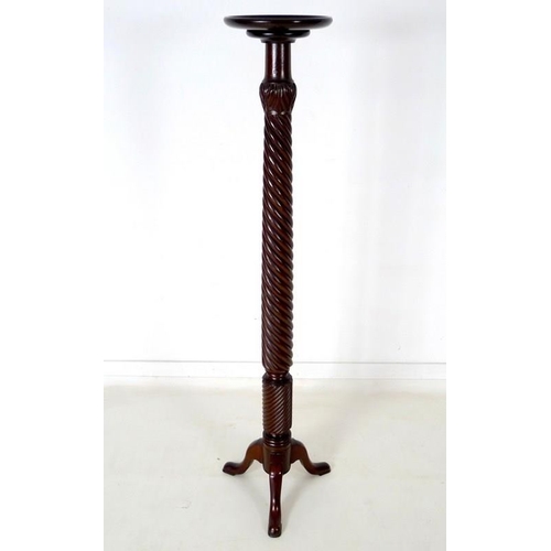 933 - An early to mid 20th century mahogany torchere, with barley twist stem and tripod base, 40 by 152cm ... 