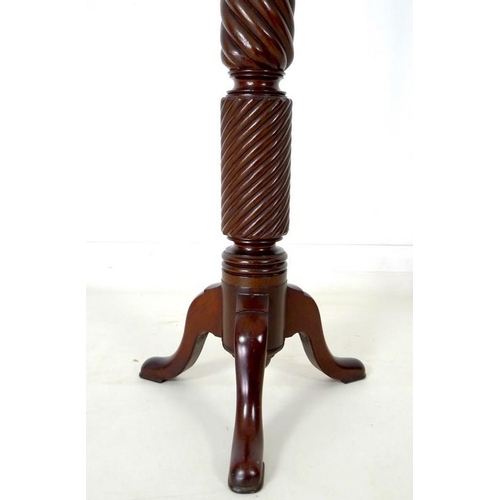 933 - An early to mid 20th century mahogany torchere, with barley twist stem and tripod base, 40 by 152cm ... 