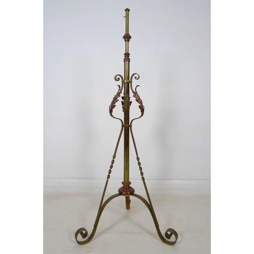 937A - An early 20th century Arts and Crafts brass and copper standard lamp stand, in the manner of W.A. Be... 