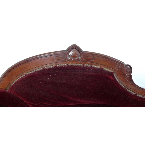 939 - A late Victorian mahogany chaise longue, with carved decoration, turned legs and castors, upholstere... 