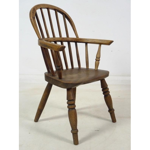 943 - A group of three Victorian low backed Windsor chairs, one with pierced and shaped splat and crinolin... 