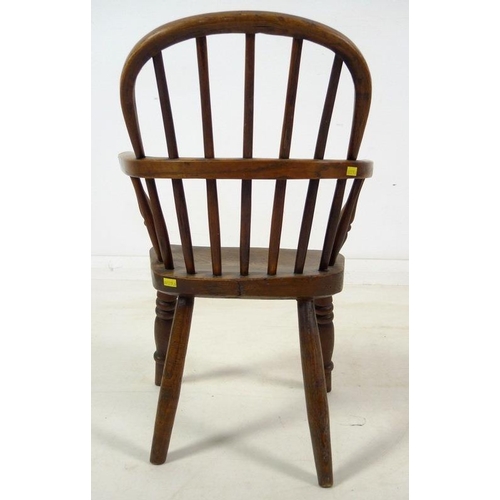 943 - A group of three Victorian low backed Windsor chairs, one with pierced and shaped splat and crinolin... 