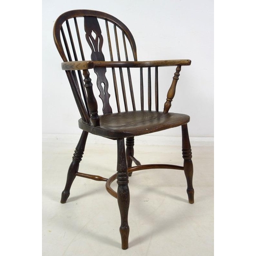 943 - A group of three Victorian low backed Windsor chairs, one with pierced and shaped splat and crinolin... 