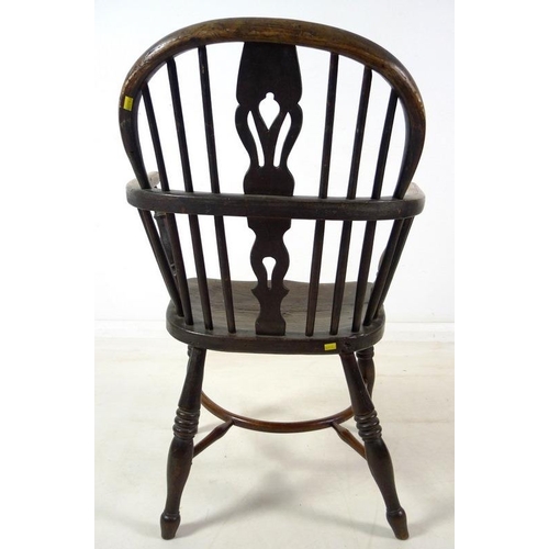 943 - A group of three Victorian low backed Windsor chairs, one with pierced and shaped splat and crinolin... 