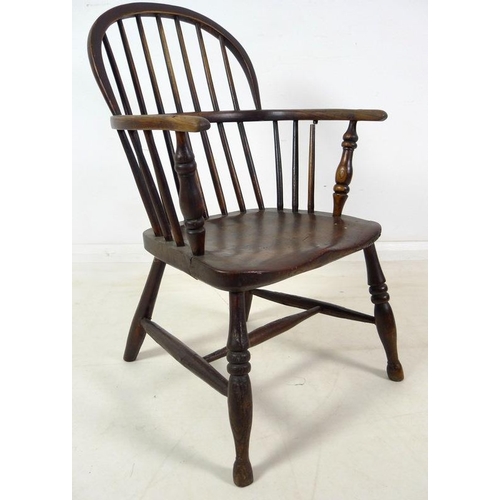 943 - A group of three Victorian low backed Windsor chairs, one with pierced and shaped splat and crinolin... 