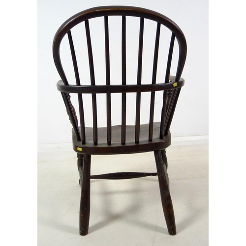 943 - A group of three Victorian low backed Windsor chairs, one with pierced and shaped splat and crinolin... 