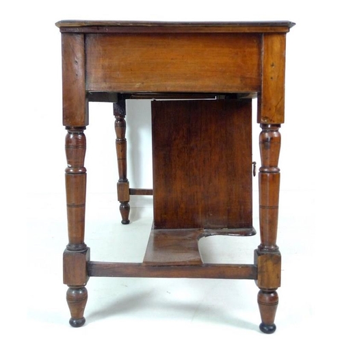 946 - An Edwardian hall table, with two frieze drawers and cupboard beneath, brass handles, turned support... 