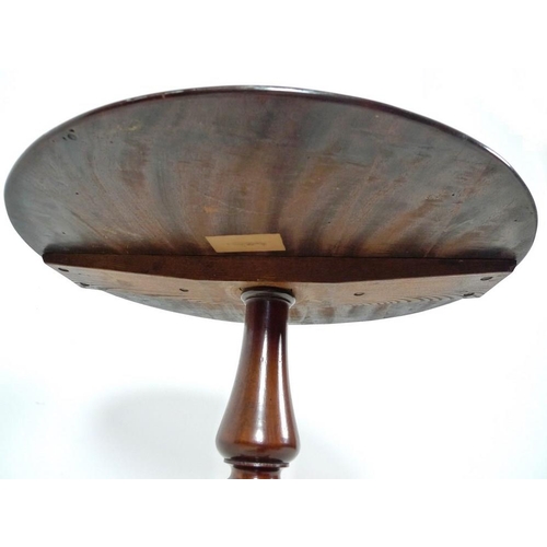 947 - A Victorian mahogany occasional table, circular surface with moulded edge, turned column raised on t... 