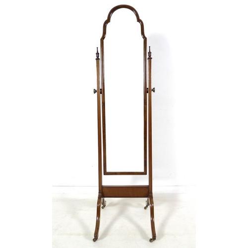 951 - An Edwardian mahogany cheval dressing mirror, rectangular plate with break arch top in a cushion mou... 