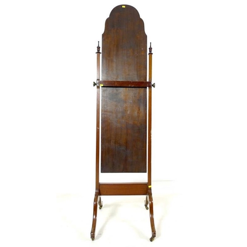 951 - An Edwardian mahogany cheval dressing mirror, rectangular plate with break arch top in a cushion mou... 