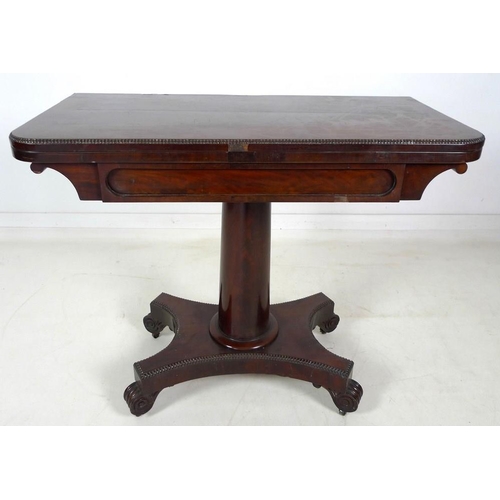 967 - A William IV flame mahogany card table, swivel and fold over surface, raised on a plain gun barrel c... 