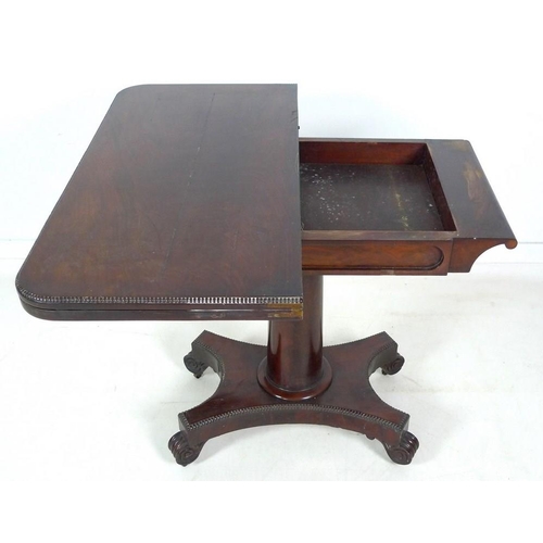 967 - A William IV flame mahogany card table, swivel and fold over surface, raised on a plain gun barrel c... 