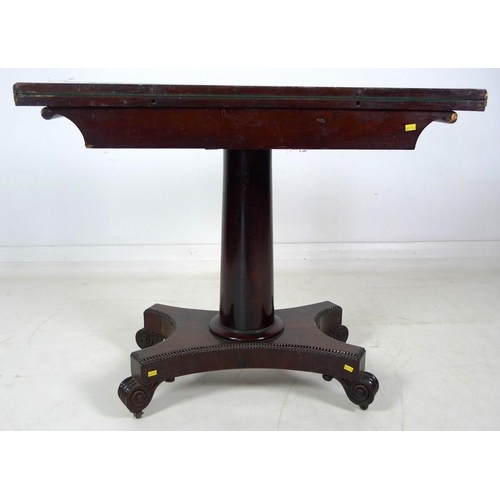 967 - A William IV flame mahogany card table, swivel and fold over surface, raised on a plain gun barrel c... 