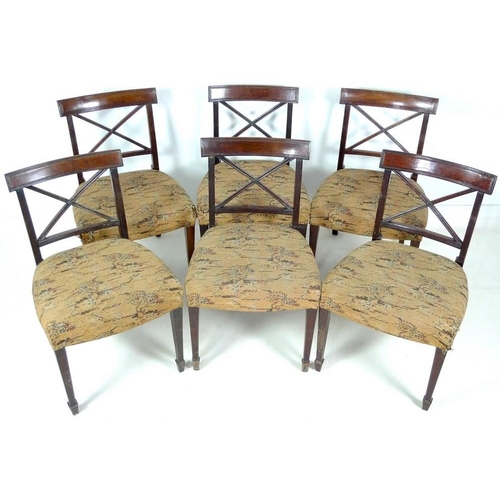 968 - A set of six late George III mahogany dining chairs, with reeded decoration, X shaped back, curved r... 