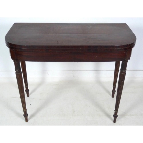 970 - A Regency mahogany card table, D form fold over surface with ebony stringing, revealing a pink baize... 