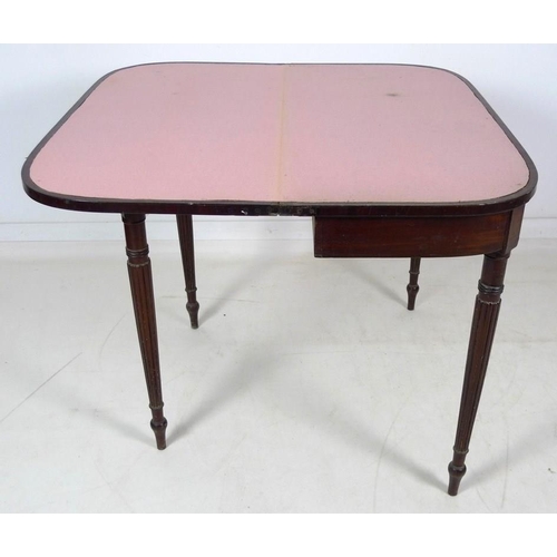 970 - A Regency mahogany card table, D form fold over surface with ebony stringing, revealing a pink baize... 