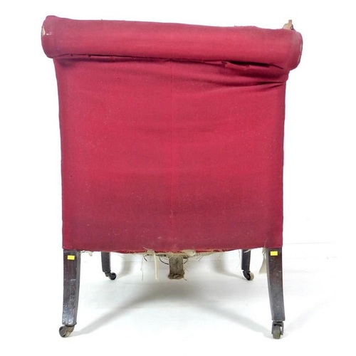 974 - A 19th century mahogany framed easy armchair, in the manner of Howard & Sons, with scroll back and s... 