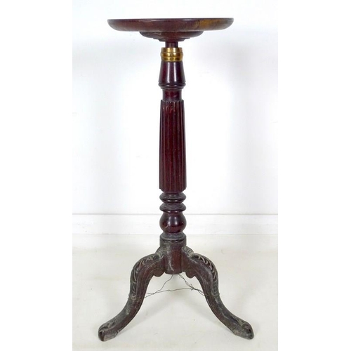 979 - An early Victorian mahogany candle stand, circular dished surface on an adjustable column with brass... 