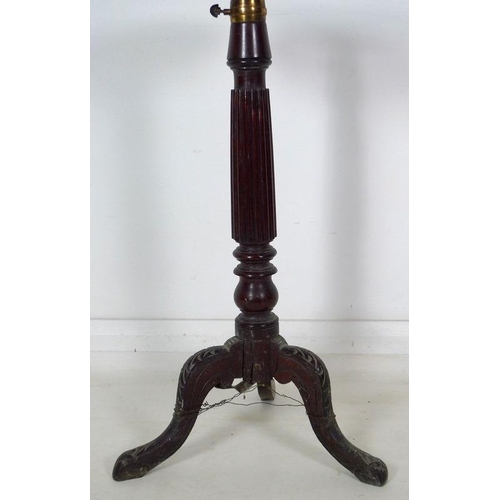 979 - An early Victorian mahogany candle stand, circular dished surface on an adjustable column with brass... 