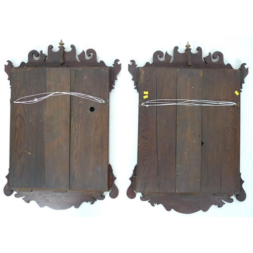 983 - A pair of late 19th century wall mirrors, in Georgian style, each with fretwork fames and inset shel... 