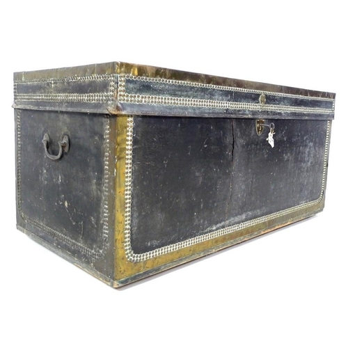 984 - A late George III black leather travelling trunk, with brass bound and studded decoration, brass shi... 