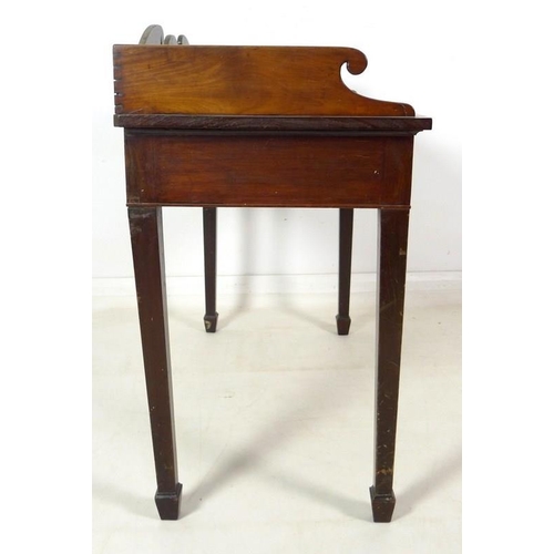 988 - A Victorian mahogany side table, three quarter gallery with scroll end decoration, two frieze drawer... 