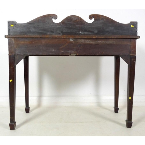 988 - A Victorian mahogany side table, three quarter gallery with scroll end decoration, two frieze drawer... 